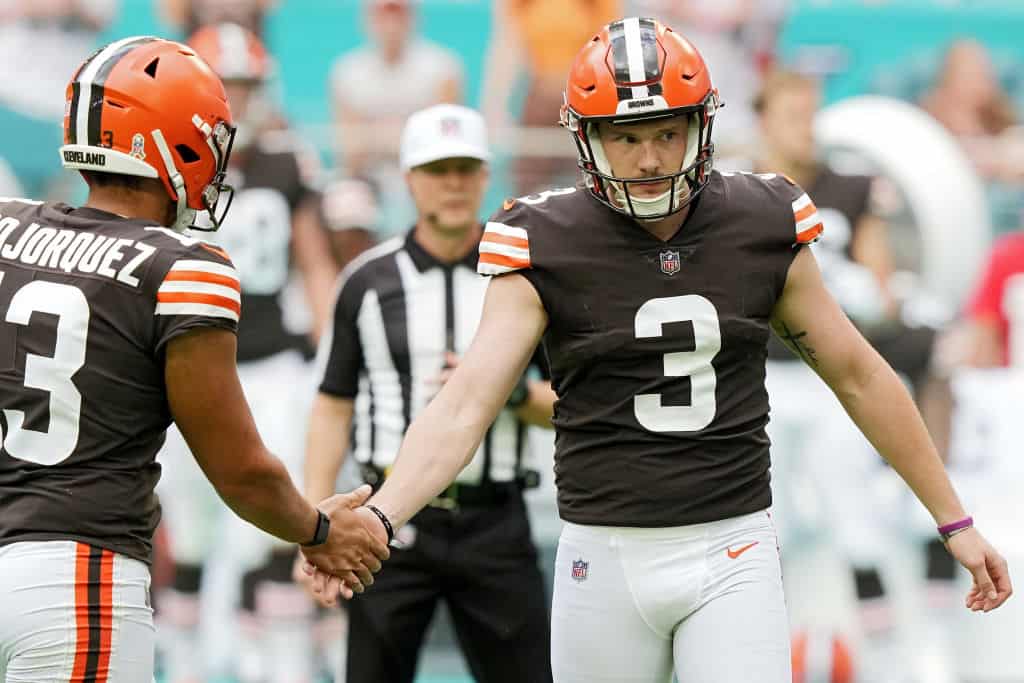 Cade York #3 of the Cleveland Browns celebrates with Corey Bojorquez #13 of the Cleveland Browns after a successful field goal in the third quarter of the game against the Miami Dolphins at Hard Rock Stadium on November 13, 2022 in Miami Gardens, Florida.