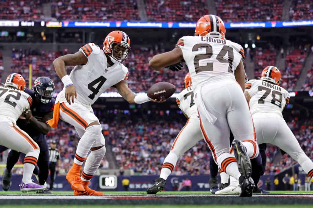 Deshaun Watson #4 of the Cleveland Browns hands the ball off to Nick Chubb #24 of the Cleveland Browns during the second quarter against the Houston Texans at NRG Stadium on December 04, 2022 in Houston, Texas.