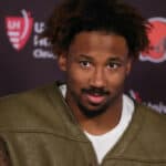 Myles Garrett #95 of the Cleveland Browns speaks with media following a game against the Cleveland Browns at NRG Stadium on December 04, 2022 in Houston, Texas.