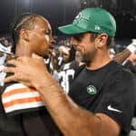 Dorian Thompson-Robinson #17 of the Cleveland Browns talks with Aaron Rodgers #8 of the New York Jets after the Browns defeated the Jets 21-16 in the 2023 Pro Hall of Fame Game at Tom Benson Hall Of Fame Stadium on August 3, 2023 in Canton, Ohio.
