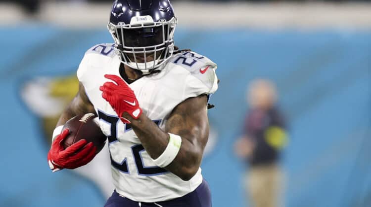 Derrick Henry #22 of the Tennessee Titans runs the ball during the first quarter against the Jacksonville Jaguars at TIAA Bank Field on January 07, 2023 in Jacksonville, Florida.