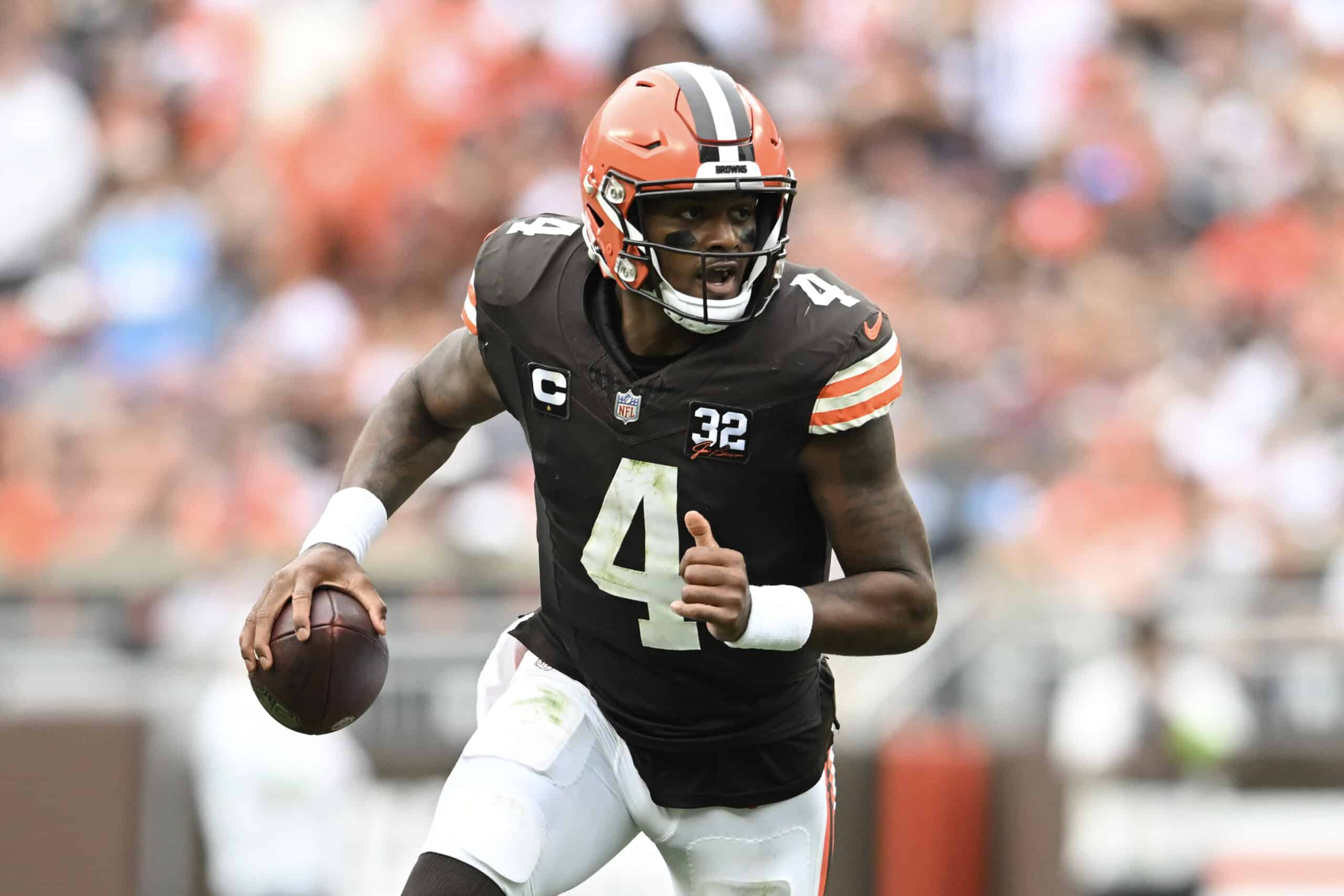 Deshaun Watson #4 of the Cleveland Browns scrambles during the third quarter in the game against the Tennessee Titans at Cleveland Browns Stadium on September 24, 2023 in Cleveland, Ohio. 