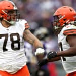 Kareem Hunt #27 of the Cleveland Browns celebrates with Jack Conklin #78 after rushing for a touchdown during the fourth quarter of the game against the Baltimore Ravens at M&T Bank Stadium on October 23, 2022 in Baltimore, Maryland.