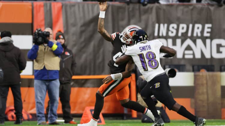 Deshaun Watson #4 of the Cleveland Browns throws a pass as he is pressured by Roquan Smith #18 of the Baltimore Ravens during the first quarter at FirstEnergy Stadium on December 17, 2022 in Cleveland, Ohio.