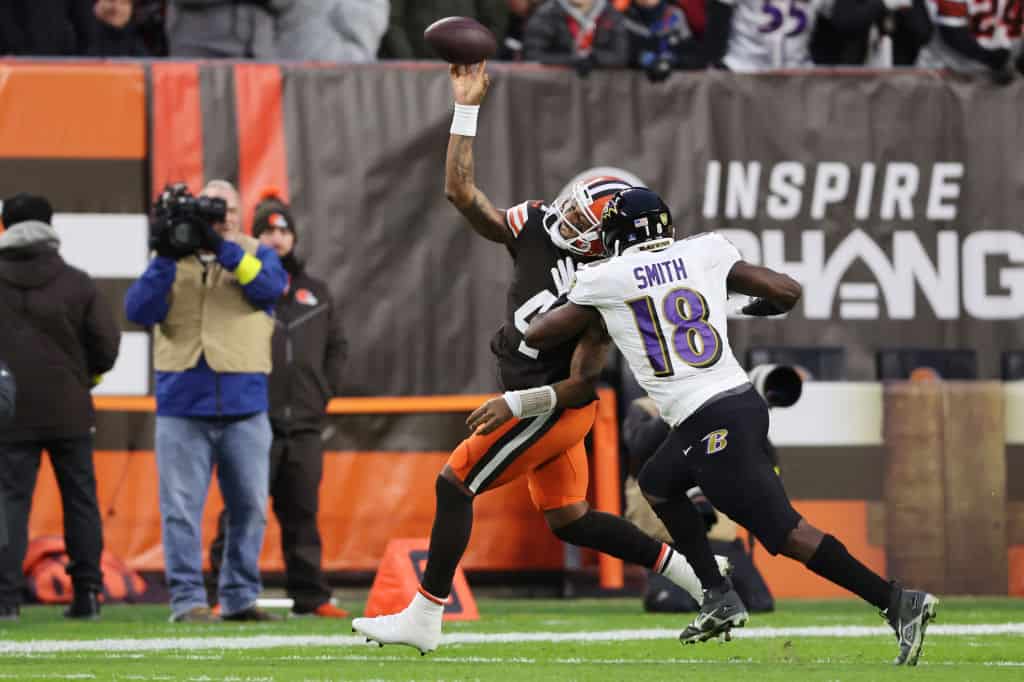 Deshaun Watson #4 of the Cleveland Browns throws a pass as he is pressured by Roquan Smith #18 of the Baltimore Ravens during the first quarter at FirstEnergy Stadium on December 17, 2022 in Cleveland, Ohio.