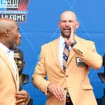 Joe Thomas yells to fans during the 2023 Pro Football Hall of Fame Enshrinement Ceremony at Tom Benson Hall Of Fame Stadium on August 05, 2023 in Canton, Ohio.
