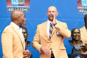 Joe Thomas yells to fans during the 2023 Pro Football Hall of Fame Enshrinement Ceremony at Tom Benson Hall Of Fame Stadium on August 05, 2023 in Canton, Ohio.