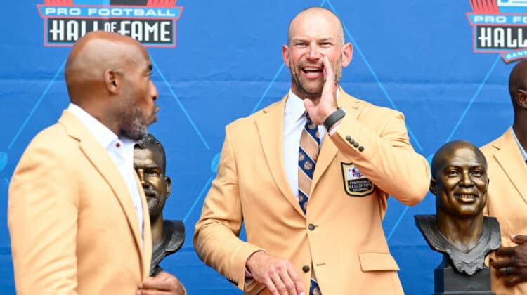 Joe Thomas yells to fans during the 2023 Pro Football Hall of Fame Enshrinement Ceremony at Tom Benson Hall Of Fame Stadium on August 05, 2023 in Canton, Ohio.