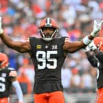 Myles Garrett #95 of the Cleveland Browns gestures to the fans during the first half against the Cincinnati Bengals at Cleveland Browns Stadium on September 10, 2023 in Cleveland, Ohio.