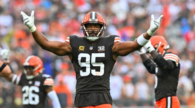 Myles Garrett #95 of the Cleveland Browns gestures to the fans during the first half against the Cincinnati Bengals at Cleveland Browns Stadium on September 10, 2023 in Cleveland, Ohio.