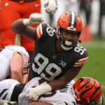 Za'Darius Smith #99 of the Cleveland Browns celebrates a tackle on Joe Mixon #28 of the Cincinnati Bengals during the first half at Cleveland Browns Stadium on September 10, 2023 in Cleveland, Ohio.