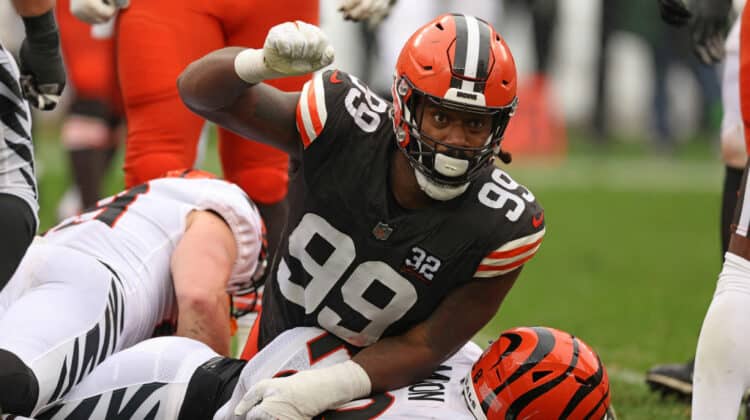 Za'Darius Smith #99 of the Cleveland Browns celebrates a tackle on Joe Mixon #28 of the Cincinnati Bengals during the first half at Cleveland Browns Stadium on September 10, 2023 in Cleveland, Ohio.