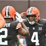 Deshaun Watson #4 of the Cleveland Browns is congratulated by Amari Cooper #2 after scoring a rushing touchdown against the Cincinnati Bengals during the first half at Cleveland Browns Stadium on September 10, 2023 in Cleveland, Ohio.