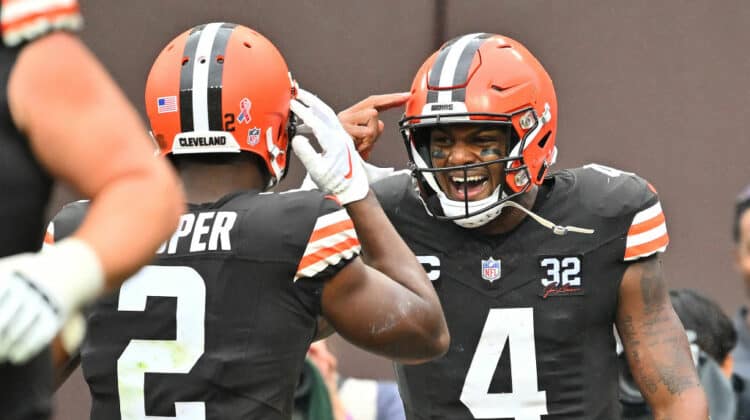Deshaun Watson #4 of the Cleveland Browns is congratulated by Amari Cooper #2 after scoring a rushing touchdown against the Cincinnati Bengals during the first half at Cleveland Browns Stadium on September 10, 2023 in Cleveland, Ohio.