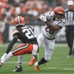 Joe Mixon #28 of the Cincinnati Bengals runs the ball against Denzel Ward #21 of the Cleveland Browns during the second half at Cleveland Browns Stadium on September 10, 2023 in Cleveland, Ohio.