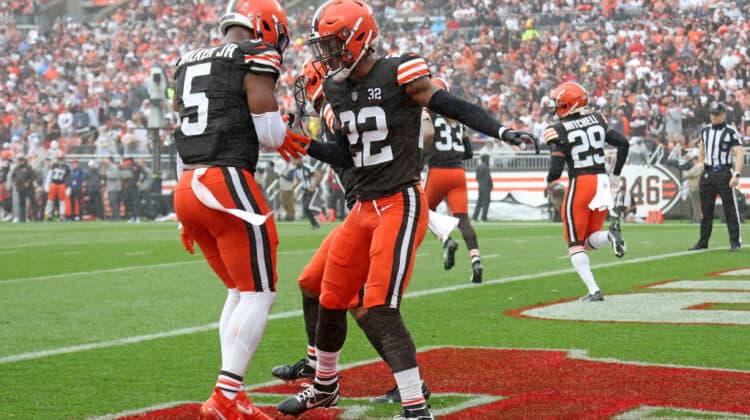 Grant Delpit #22 of the Cleveland Browns celebrates with Anthony Walker Jr. #5 after breaking up a pass against the Cincinnati Bengals during the second half at Cleveland Browns Stadium on September 10, 2023 in Cleveland, Ohio.