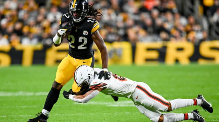 Najee Harris #22 of the Pittsburgh Steelers carries the ball against Greg Newsome II #0 of the Cleveland Browns during the second quarter at Acrisure Stadium on September 18, 2023 in Pittsburgh, Pennsylvania.