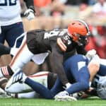 Ryan Tannehill #17 of the Tennessee Titans is tackled by Ogbo Okoronkwo #54 of the Cleveland Browns during the first half at Cleveland Browns Stadium on September 24, 2023 in Cleveland, Ohio.