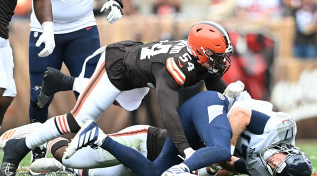 Ryan Tannehill #17 of the Tennessee Titans is tackled by Ogbo Okoronkwo #54 of the Cleveland Browns during the first half at Cleveland Browns Stadium on September 24, 2023 in Cleveland, Ohio.