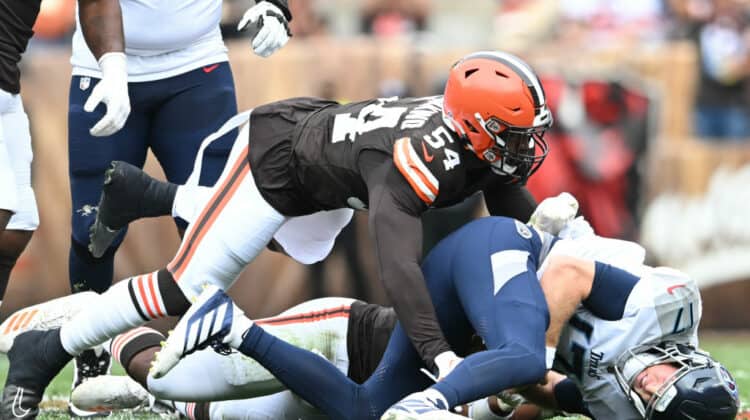 Ryan Tannehill #17 of the Tennessee Titans is tackled by Ogbo Okoronkwo #54 of the Cleveland Browns during the first half at Cleveland Browns Stadium on September 24, 2023 in Cleveland, Ohio.