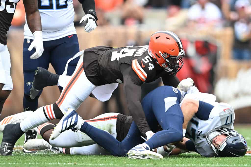 Ryan Tannehill #17 of the Tennessee Titans is tackled by Ogbo Okoronkwo #54 of the Cleveland Browns during the first half at Cleveland Browns Stadium on September 24, 2023 in Cleveland, Ohio.