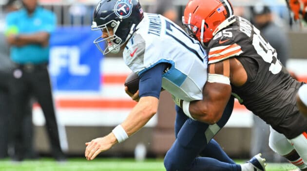 Ryan Tannehill #17 of the Tennessee Titans is sacked by Myles Garrett #95 of the Cleveland Browns during the fourth quarter at Cleveland Browns Stadium on September 24, 2023 in Cleveland, Ohio.