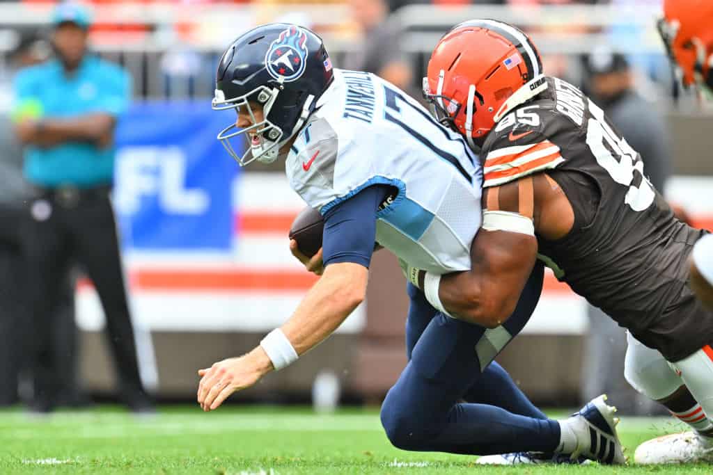 Ryan Tannehill #17 of the Tennessee Titans is sacked by Myles Garrett #95 of the Cleveland Browns during the fourth quarter at Cleveland Browns Stadium on September 24, 2023 in Cleveland, Ohio.