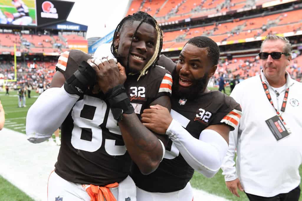 David Njoku #85 and Anthony Walker Jr. #5 of the Cleveland Browns celebrate a win over the Tennessee Titans at Cleveland Browns Stadium on September 24, 2023 in Cleveland, Ohio.
