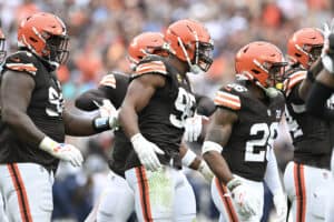 Myles Garrett #95 of the Cleveland Browns celebrates with teammates after sacking Ryan Tannehill #17 of the Tennessee Titans during the fourth quarter of a game at Cleveland Browns Stadium on September 24, 2023 in Cleveland, Ohio.