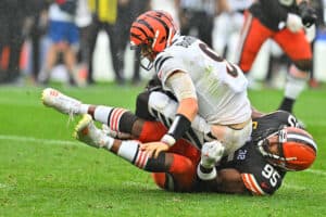 Joe Burrow #9 of the Cincinnati Bengals is sacked by Myles Garrett #95 of the Cleveland Browns during the second half at Cleveland Browns Stadium on September 10, 2023 in Cleveland, Ohio.