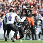 Elijah Moore #8 of the Cleveland Browns catches a pass in front of Roquan Smith #0 of the Baltimore Ravens and Ronald Darby #28 of the Baltimore Ravens during the second half at Cleveland Browns Stadium on October 01, 2023 in Cleveland, Ohio.