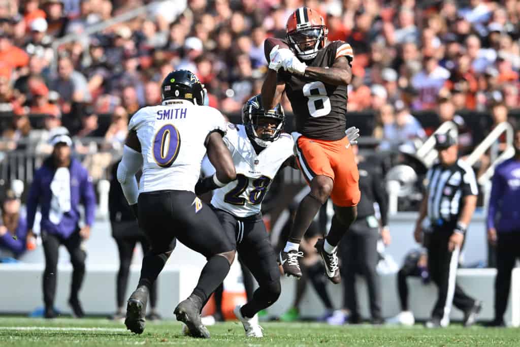 Elijah Moore #8 of the Cleveland Browns catches a pass in front of Roquan Smith #0 of the Baltimore Ravens and Ronald Darby #28 of the Baltimore Ravens during the second half at Cleveland Browns Stadium on October 01, 2023 in Cleveland, Ohio.