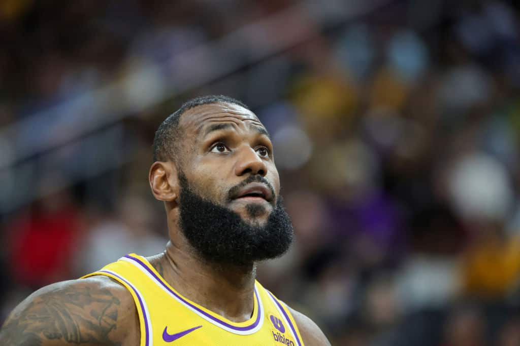LeBron James #23 of the Los Angeles Lakers stands on the court during a break in the first quarter of a preseason game against the Brooklyn Nets at T-Mobile Arena on October 09, 2023 in Las Vegas, Nevada. The Lakers defeated the Nets 129-126.