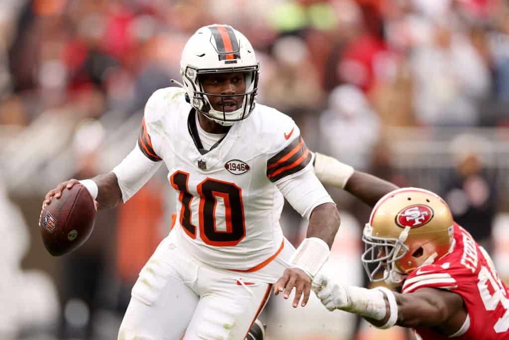 PJ Walker #10 of the Cleveland Browns attempts a pass while pressured by Clelin Ferrell #94 of the San Francisco 49ers during the fourth quarter at Cleveland Browns Stadium on October 15, 2023 in Cleveland, Ohio.
