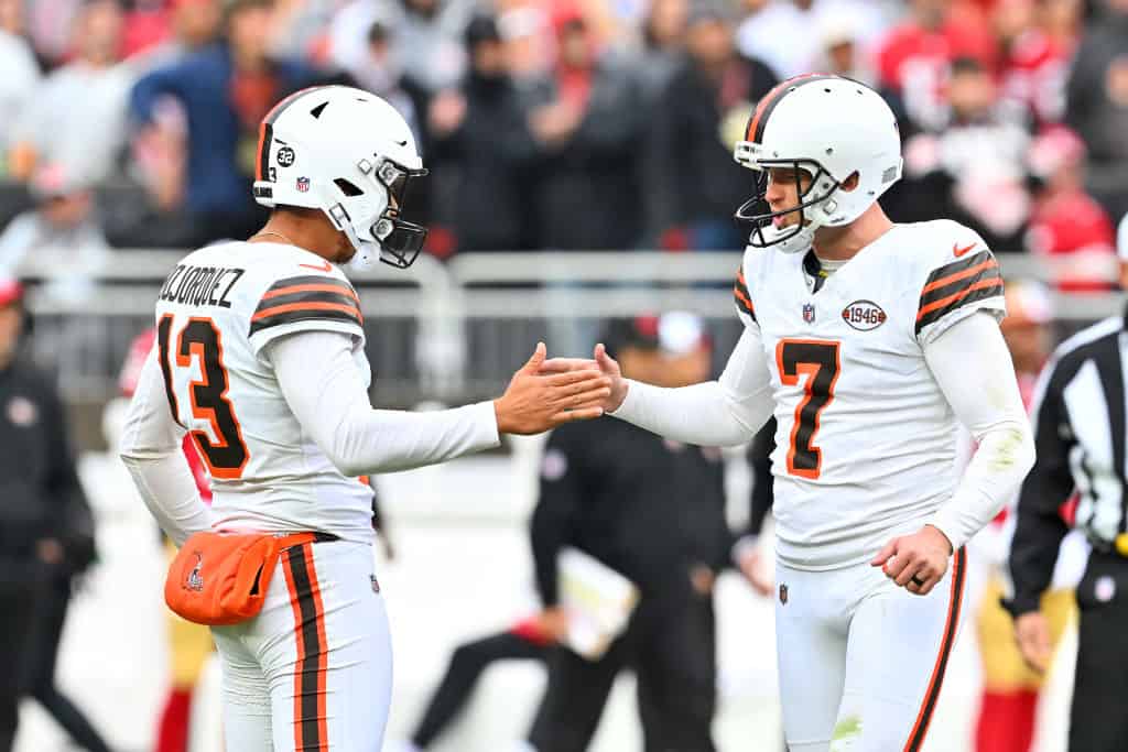 Corey Bojorquez #13 of the Cleveland Browns celebrates with Dustin Hopkins #7 of the Cleveland Browns after Hopkins' go ahead field goal during the fourth quarter against the San Francisco 49ers at Cleveland Browns Stadium on October 15, 2023 in Cleveland, Ohio.