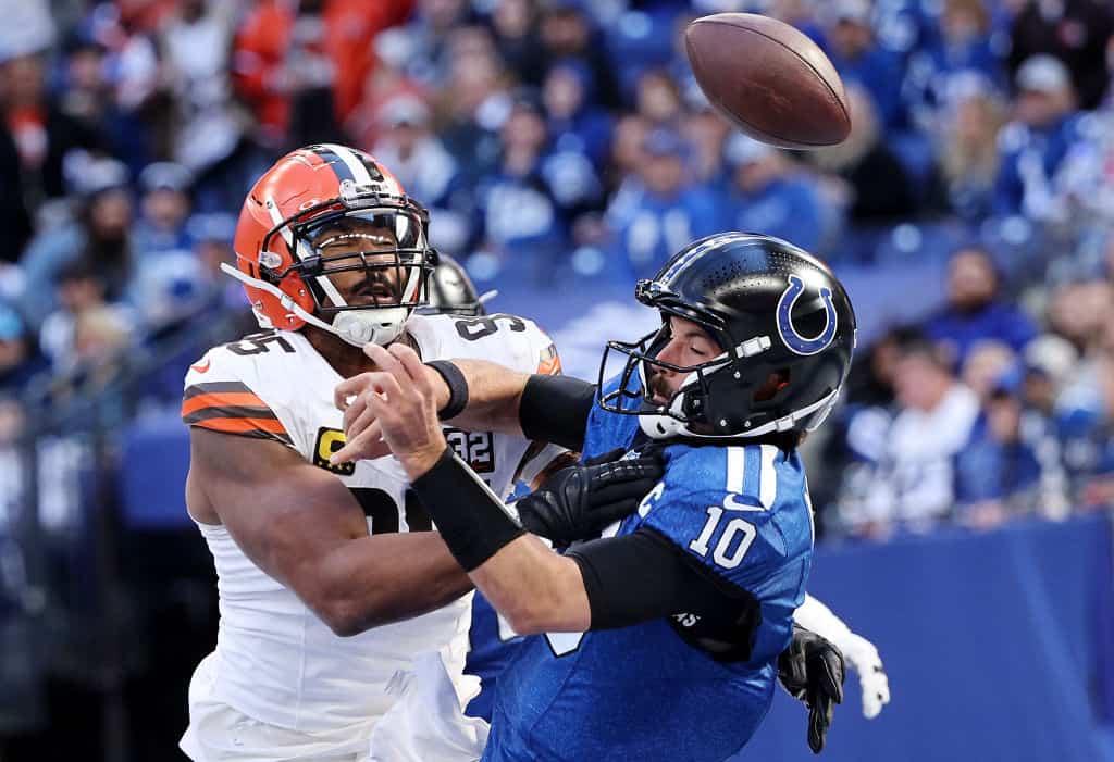Gardner Minshew #10 of the Indianapolis Colts fumbles the ball against Myles Garrett #95 of the Cleveland Browns during the second quarter at Lucas Oil Stadium on October 22, 2023 in Indianapolis, Indiana.