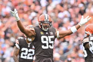 Myles Garrett #95 of the Cleveland Browns reacts after a play during the first half in the game against the Tennessee Titans at Cleveland Browns Stadium on September 24, 2023 in Cleveland, Ohio.