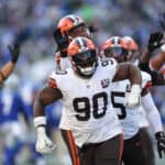 Maurice Hurst II #90 of the Cleveland Browns celebrates an interception during the third quarter of a game against the Seattle Seahawks at Lumen Field on October 29, 2023 in Seattle, Washington.