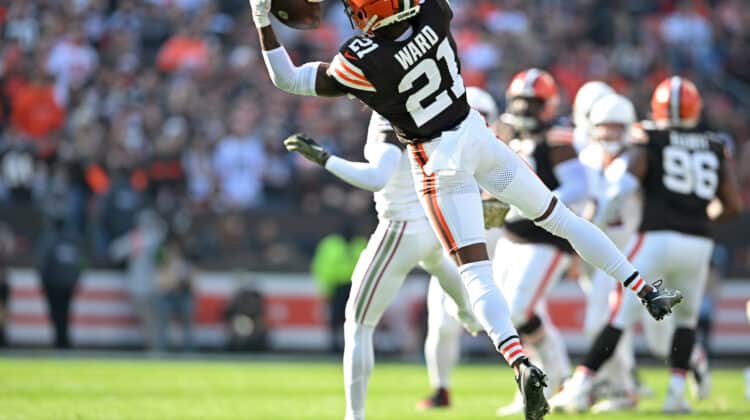 CLEVELAND, OHIO - NOVEMBER 05: Denzel Ward #21 of the Cleveland Browns intercepts a pass against the Arizona Cardinals during the first half of the game at Cleveland Browns Stadium on November 05, 2023 in Cleveland, Ohio.