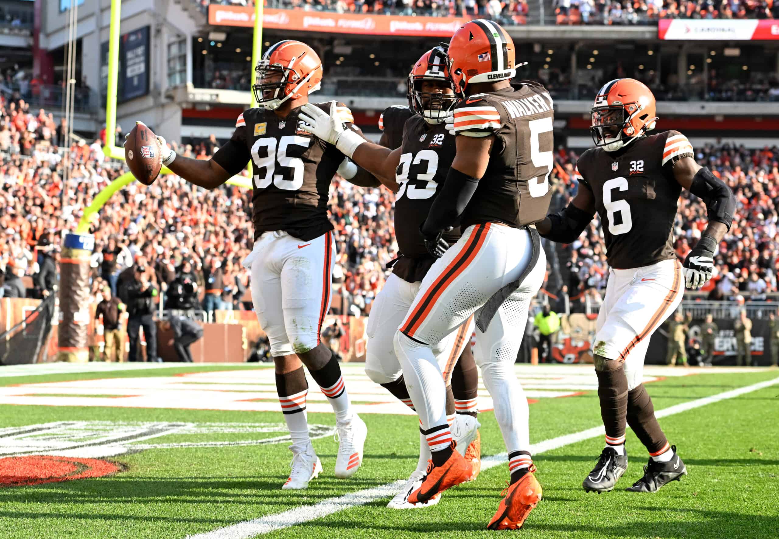 Myles Garrett #95 of the Cleveland Browns celebrates after recovering a fumble forced by Shelby Harris #93 of the Cleveland Browns during the third quarter of the game against the Arizona Cardinals at Cleveland Browns Stadium on November 05, 2023 in Cleveland, Ohio.