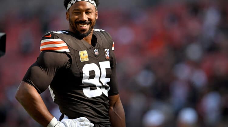 Myles Garrett #95 of the Cleveland Browns looks on before the game against the Arizona Cardinals at Cleveland Browns Stadium on November 05, 2023 in Cleveland, Ohio.