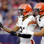 HOUSTON, TEXAS - DECEMBER 04: Denzel Ward #21 of the Cleveland Browns and Greg Newsome II #20 of the Cleveland Browns celebrate after Ward's fumble recovery for a touchdown during the third quarter against the Houston Texans at NRG Stadium on December 04, 2022 in Houston, Texas.