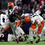 HOUSTON, TEXAS - JANUARY 13: Christian Harris #48 of the Houston Texans sacks Joe Flacco #15 of the Cleveland Browns during the third quarter in the AFC Wild Card Playoffs at NRG Stadium on January 13, 2024 in Houston, Texas.