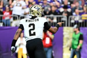 Jameis Winston #2 of the New Orleans Saints celebrates after a touchdown against the Minnesota Vikings during the third quarter at U.S. Bank Stadium on November 12, 2023 in Minneapolis, Minnesota.