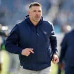Tennessee Titans head coach Mike Vrabel runs on the field before the game against the Jacksonville Jaguars at Nissan Stadium on January 07, 2024 in Nashville, Tennessee.