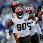 Maurice Hurst II #90 of the Cleveland Browns celebrates his interception against the Seattle Seahawks during the third quarter at Lumen Field on October 29, 2023 in Seattle, Washington.