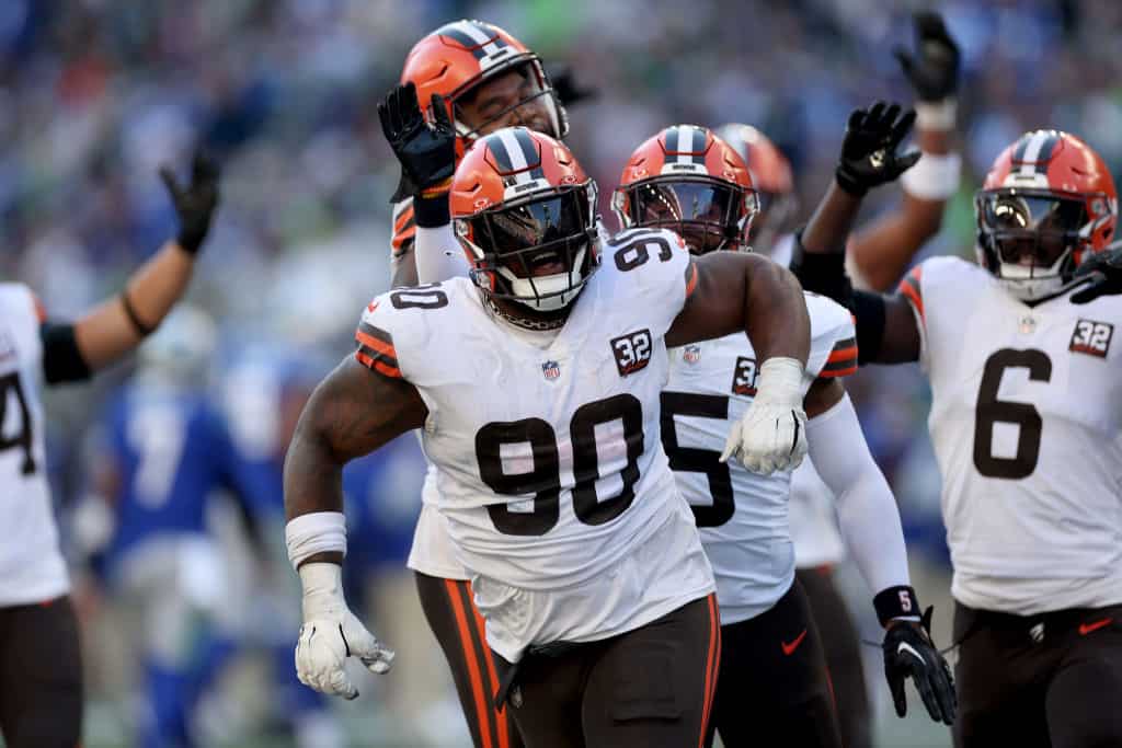 Maurice Hurst II #90 of the Cleveland Browns celebrates his interception against the Seattle Seahawks during the third quarter at Lumen Field on October 29, 2023 in Seattle, Washington.