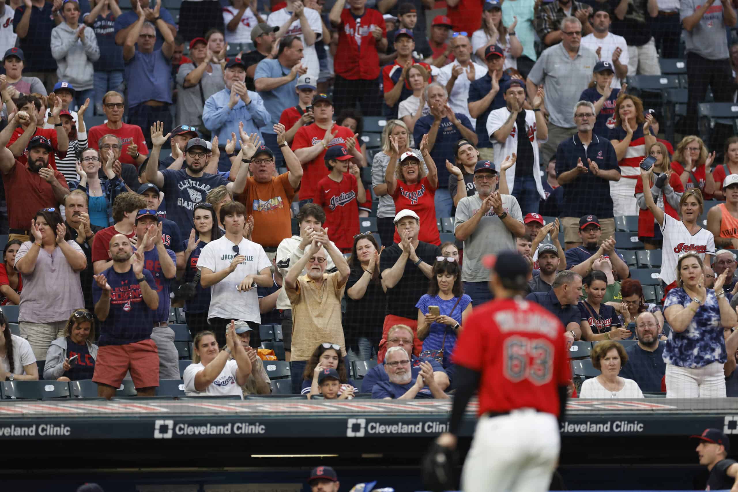 CLEVELAND, OH - JUNE 21: Fans give Gavin Williams #63 of the Cleveland Guardians a standing ovation after he is removed from his major league debut against the Oakland Athletics during the sixth inning at Progressive Field on June 21, 2023 in Cleveland, Ohio.