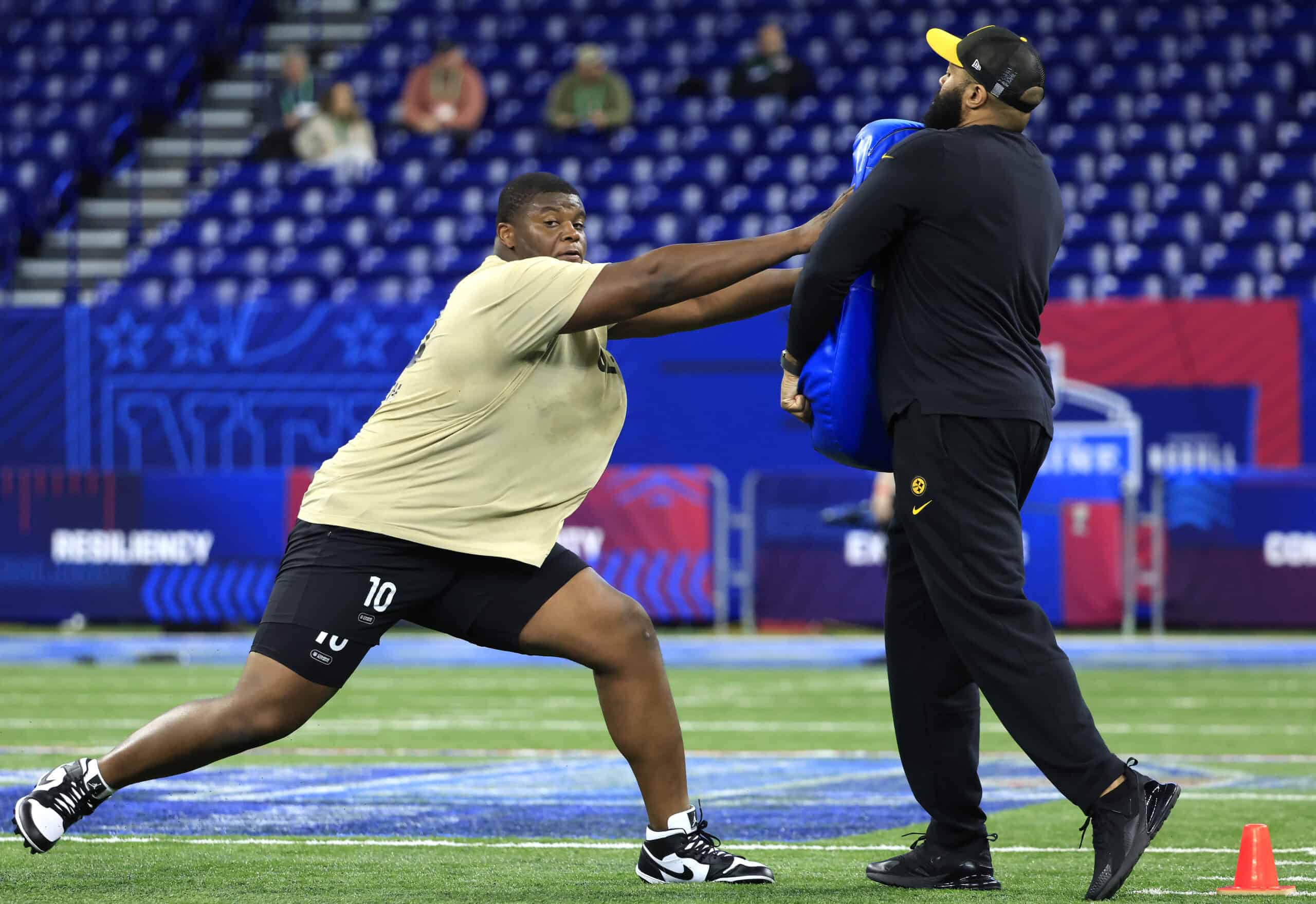 INDIANAPOLIS, INDIANA - MARCH 03: Javion Cohen #OL10 of Miami-Fl participates in a drill during the NFL Combine at Lucas Oil Stadium on March 03, 2024 in Indianapolis, Indiana.