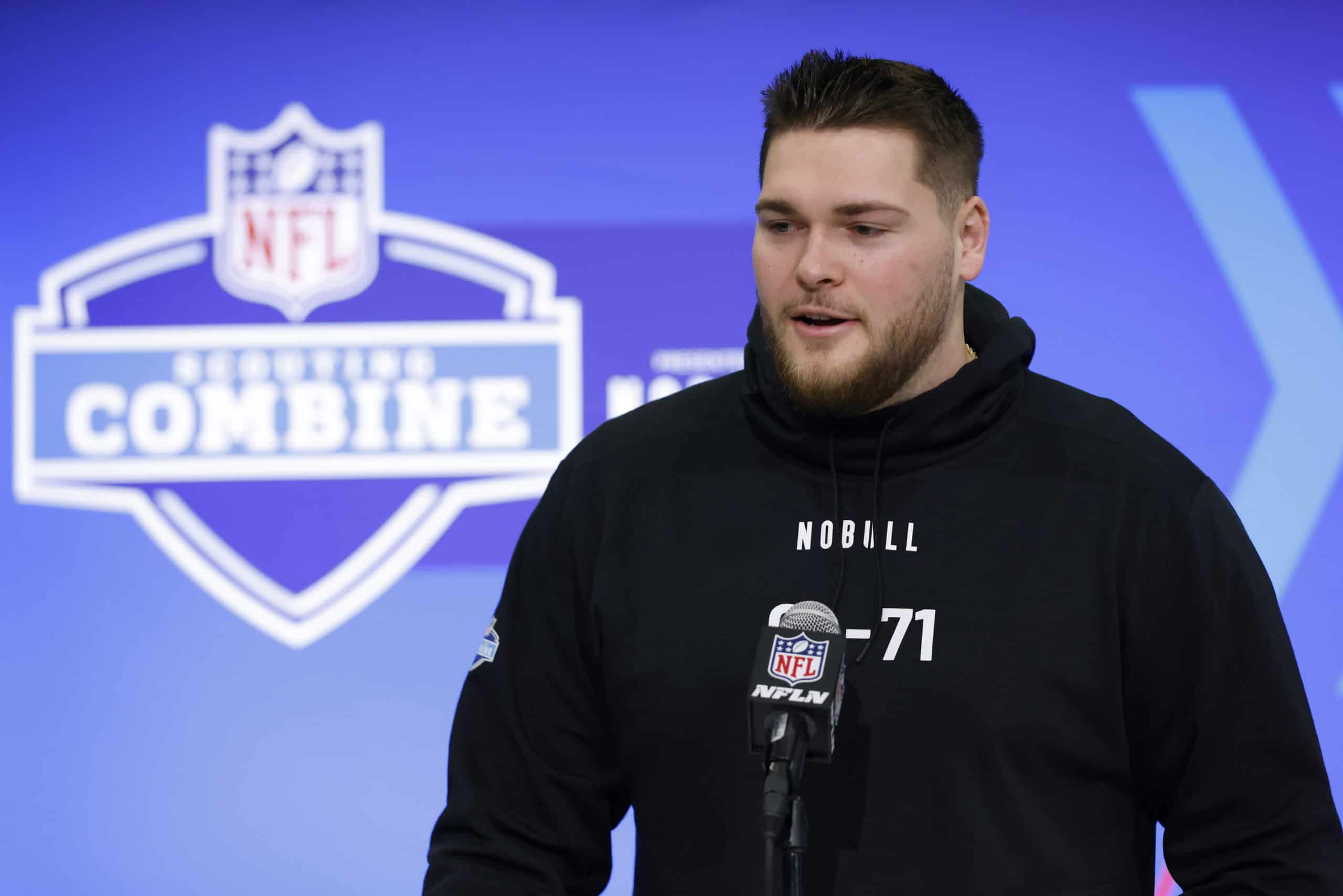 INDIANAPOLIS, INDIANA - MARCH 02: Zak Zinter #OL71 of the Michigan Wolverines speaks to the media during the 2024 NFL Combine at the Indiana Convention Center on March 2, 2024 in Indianapolis, Indiana.